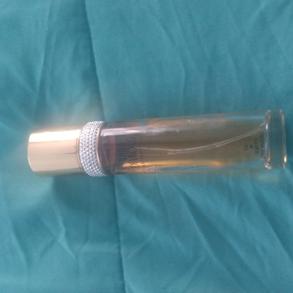 White Diamonds by Elizabeth Taylor.  3.3 oz.  Bottle is a little over half full.